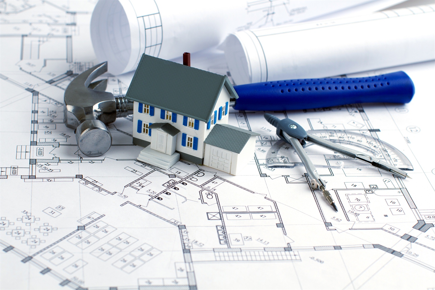New Construction Image of House, Blue Prints, and construction tools 